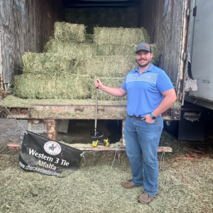 Our rep, Geff Cosgrave, standing next to hay. He visits your farm for Hay Quality Testing in Georgia